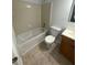 Clean bathroom with a tub, toilet, and vanity at 6745 Trafalger Sq, Norcross, GA 30093