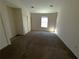 Spacious bedroom with carpet, window, and double closets at 6745 Trafalger Sq, Norcross, GA 30093