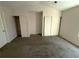 Well-lit bedroom with double closets and carpet flooring at 6745 Trafalger Sq, Norcross, GA 30093