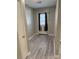Bright entryway with gray vinyl flooring and door to outside at 6745 Trafalger Sq, Norcross, GA 30093