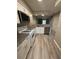 Open kitchen features granite counters and stainless steel appliances at 6745 Trafalger Sq, Norcross, GA 30093