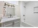 Updated bathroom featuring modern fixtures and a tub with shower at 2502 Park Dr, Lithonia, GA 30058
