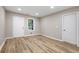 Bright bedroom featuring wood floors, recessed lighting, and a double door closet at 2502 Park Dr, Lithonia, GA 30058