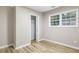 Bedroom with wood flooring, closet, and one window at 2502 Park Dr, Lithonia, GA 30058