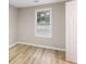 Cozy bedroom with bright natural lighting and new floors at 2502 Park Dr, Lithonia, GA 30058