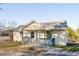 Inviting single-story home with a cozy front porch and freshly painted light yellow exterior at 2502 Park Dr, Lithonia, GA 30058