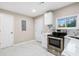 Well-lit kitchen showcasing stainless steel appliances, elegant marble countertops, and white cabinetry at 2502 Park Dr, Lithonia, GA 30058