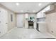 Modern kitchen with white cabinets, stainless steel appliances, and marble countertops at 2502 Park Dr, Lithonia, GA 30058