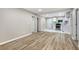 Spacious living room with wood floors that seamlessly connect to the modern kitchen at 2502 Park Dr, Lithonia, GA 30058