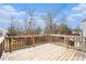 View from the wooden back deck overlooking the tree-filled backyard at 9106 Hanover St, Lithia Springs, GA 30122