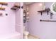 Small bathroom with lavender walls and rustic shelving at 101 Emily Ln, Carrollton, GA 30116