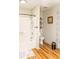 Bathroom featuring a shower and toilet with wood flooring at 101 Emily Ln, Carrollton, GA 30116