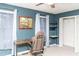 Bedroom with stylish desk, office chair, open closet shelving, and blue accent walls at 101 Emily Ln, Carrollton, GA 30116