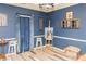 Charming dining room with blue walls and unique decor at 101 Emily Ln, Carrollton, GA 30116