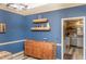 Dining room boasting a vintage wooden dresser and two rustic floating shelves at 101 Emily Ln, Carrollton, GA 30116