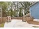 Gated driveway leading to a home with a wooded backyard and privacy fence at 101 Emily Ln, Carrollton, GA 30116