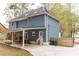 Rear view of house with covered patio and backyard at 101 Emily Ln, Carrollton, GA 30116