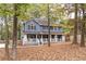 Two-story house with wrap around porch, shutters and landscaping at 101 Emily Ln, Carrollton, GA 30116