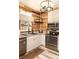 Well-designed kitchen with white cabinets, stainless appliances, and rustic wood paneling at 101 Emily Ln, Carrollton, GA 30116