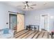 Bright living room with barn door, hardwood floors, and cozy seating at 101 Emily Ln, Carrollton, GA 30116