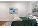 Bright bedroom with a window, complemented by modern abstract art creating a serene atmosphere at 242 12Th Ne St # 14, Atlanta, GA 30309