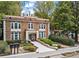 Brick apartment building with manicured landscaping and a clear walkway, presenting a welcoming facade at 242 12Th Ne St # 14, Atlanta, GA 30309