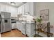 Efficient kitchen with stainless steel appliances, granite countertops, and ample cabinet space at 242 12Th Ne St # 14, Atlanta, GA 30309