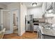 Clean kitchen with stainless steel appliances, granite countertops, and convenient access to the bathroom at 242 12Th Ne St # 14, Atlanta, GA 30309