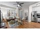 Bright living room with hardwood floors, modern furniture, and an open view to the bathroom and kitchen area at 242 12Th Ne St # 14, Atlanta, GA 30309