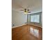 Bright bedroom featuring hardwood floors and a ceiling fan at 4090 Chastain Park Ne Ct, Atlanta, GA 30342