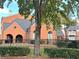 Brick building with a grassy yard and trees at 4090 Chastain Park Ne Ct, Atlanta, GA 30342