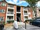 Brick apartment building with balconies and ample parking at 4090 Chastain Park Ne Ct, Atlanta, GA 30342