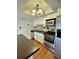 Modern kitchen with stainless steel appliances and hardwood floors at 4090 Chastain Park Ne Ct, Atlanta, GA 30342