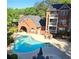 Community pool with lounge chairs and patio furniture at 4090 Chastain Park Ne Ct, Atlanta, GA 30342