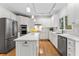 Kitchen features white cabinets, quartz countertops, and stainless steel appliances at 4510 Jenkins Way, Douglasville, GA 30135