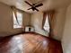 A bedroom featuring hardwood floors, windows with curtains, and natural light at 1907 Grandview Se Cir, Atlanta, GA 30316