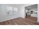 Spacious dining area with wood-look flooring and large windows connecting to the modern kitchen at 3087 Birdsong Ave, Covington, GA 30016