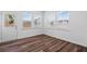 Bright, airy sunroom with ample windows and wood-look flooring leading to the backyard at 3087 Birdsong Ave, Covington, GA 30016