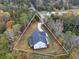 Aerial view of the property highlighting the home's location and well-maintained landscaping at 1387 Mineral Springs Rd, Hoschton, GA 30548