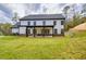 Expansive backyard with a covered patio, perfect for outdoor gatherings and relaxation at 1387 Mineral Springs Rd, Hoschton, GA 30548