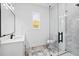 Modern bathroom boasts a glass-enclosed shower, marble floors, and vanity sink at 1387 Mineral Springs Rd, Hoschton, GA 30548
