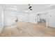 Large main bedroom featuring hardwood floors and doorways to other areas of the home at 1387 Mineral Springs Rd, Hoschton, GA 30548