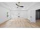 Spacious main bedroom with hardwood floors, bright windows, and a large entry way at 1387 Mineral Springs Rd, Hoschton, GA 30548