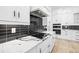 Updated kitchen featuring stone countertops and stainless steel appliances at 1387 Mineral Springs Rd, Hoschton, GA 30548