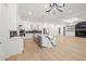 Spacious open kitchen with stone countertops and stainless steel appliances at 1387 Mineral Springs Rd, Hoschton, GA 30548