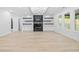 Spacious living room with large marble fireplace and black shelving at 1387 Mineral Springs Rd, Hoschton, GA 30548