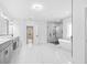 This elegant primary bath boasts dual vanities, modern fixtures, and a glass shower at 1387 Mineral Springs Rd, Hoschton, GA 30548
