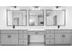 This primary bathroom features dual sinks, a vanity area, and a neutral color palette at 1387 Mineral Springs Rd, Hoschton, GA 30548
