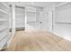 This walk-in closet has custom shelving, a built-in mirror, and plenty of hanging space at 1387 Mineral Springs Rd, Hoschton, GA 30548