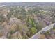 Drone shot of the treed lot, ideal for a private estate surrounded by natural landscape at 5655 Campbellton Sw Rd, Atlanta, GA 30331